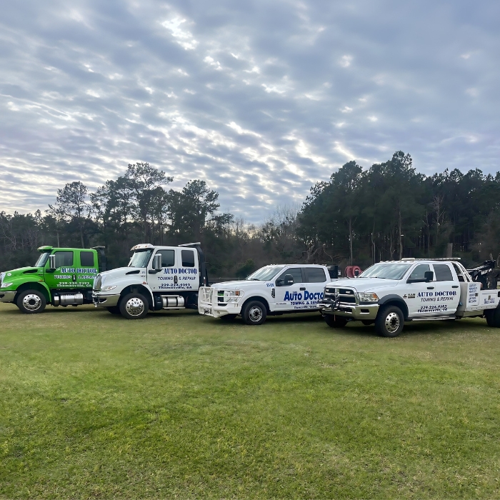 fleet of light, medium, and heavy towing trucks
